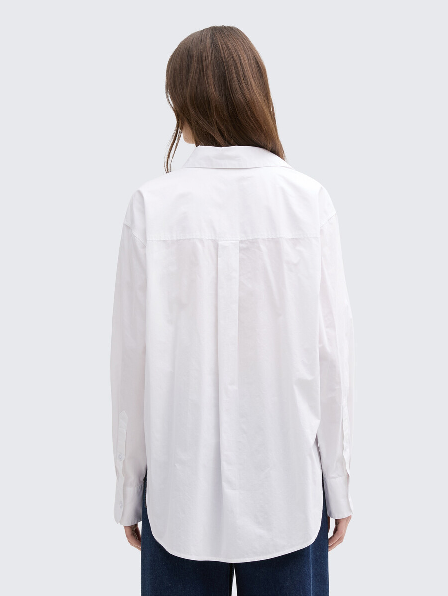 blusa oversize con taschino sul petto