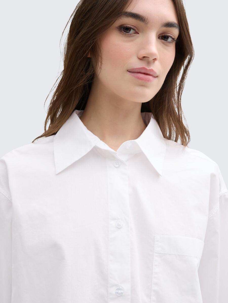 blusa oversize con taschino sul petto