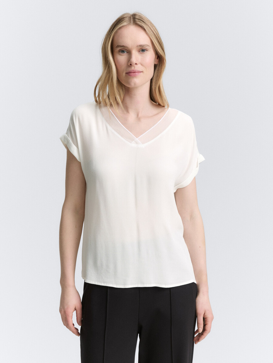 blusa ampia con scollo a v