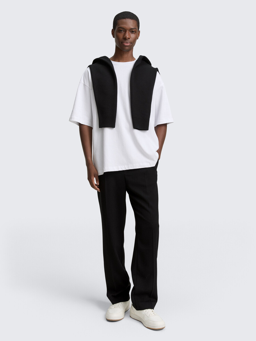 pantaloni chino larghi con piega