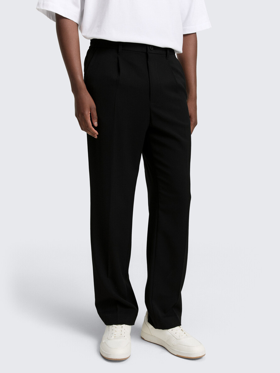 pantaloni chino larghi con piega