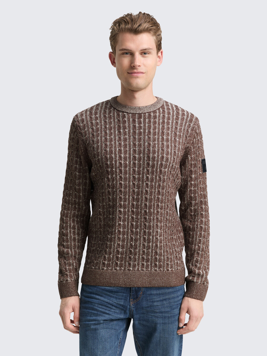 maglione lavorato a maglia con motivo a trecce